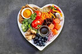 Heart-shaped plate of fresh whole foods
